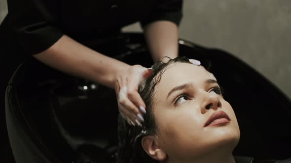 Hair Care In Fashion Studio. Beautiful Young Woman.