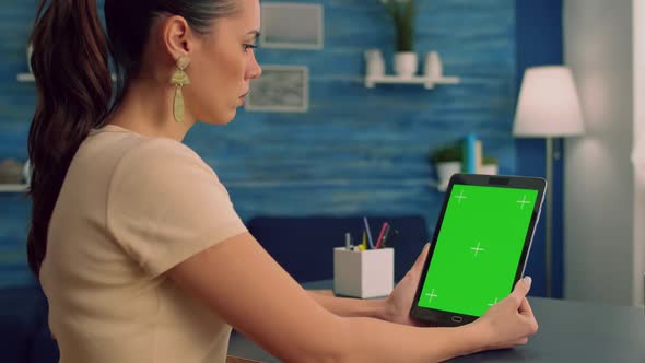 Freelancer Holding Tablet Computer with Mock Up Green Screen Chroma Key Display