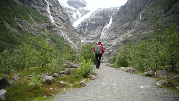 Men with Backpack on a Trail