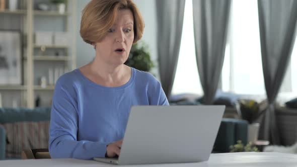 Shocked Stunned Old Senior Woman Wondering and Working on Laptop