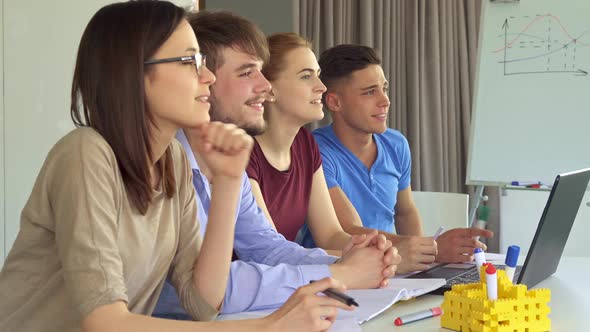 Creative Team Watches Some Presentation