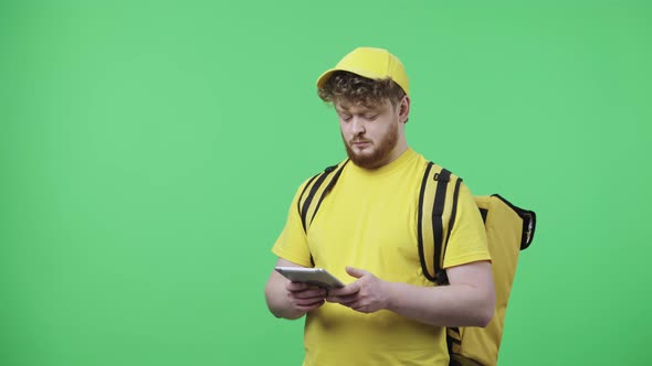 Portrait of Young Men Viewing Information on a Digital Tablet