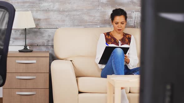 Zoom Out Shot of Business Woman Taking Note on Clipboard