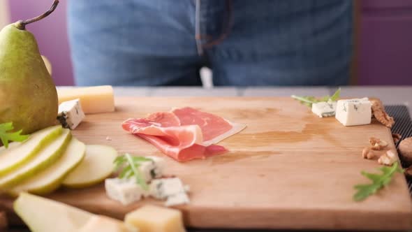 Making Pear and Blue Cheese Salad  Slices of Jamon