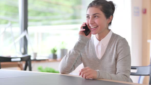 Cheerful Indian Woman Talking on Smartphone 