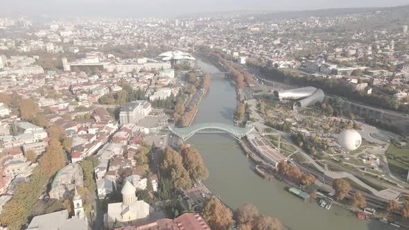 Aerial view of Tbilisi city central park and Bridge of Peace