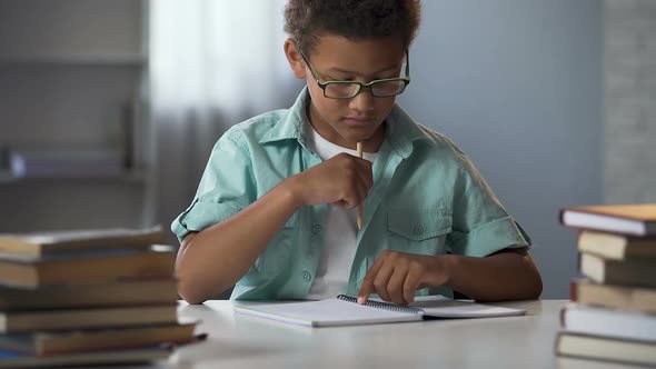 Boy With Disability to Learn Reading and Writing Skills Trying to Concentrate