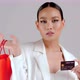 Beautiful Asian modern look businesswoman holding red shopping bag and credit card - VideoHive Item for Sale