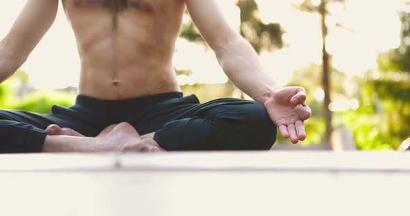 Man Sitting in Lotus Asanpracticing Yoga and Mindfullness Techniques
