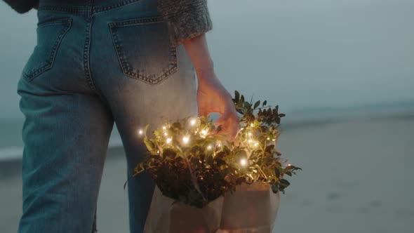 Girl Walks with Lighting Shopping Bag