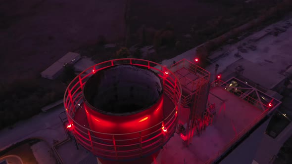Aerial Top Down View Over Industrial Pipes At Night