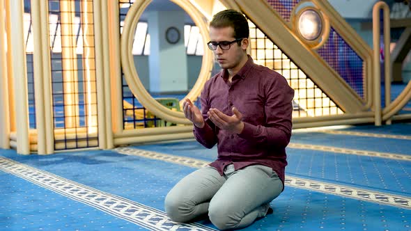 Young Muslim Praying at the Mosque