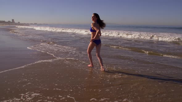 Playful Woman At The Beach