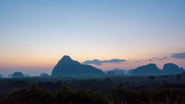 Time Lapse sunrise sky and Clouds flowing over mountain