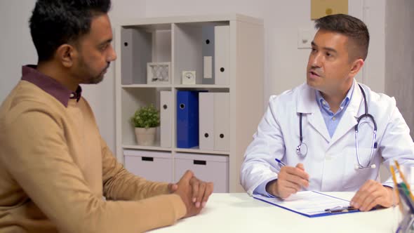 Male Doctor and Patient Talking at Hospital 15