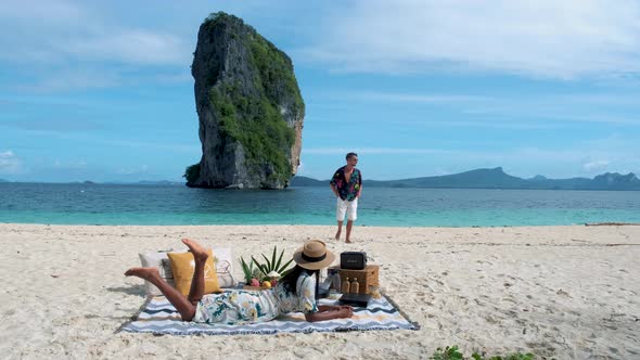 Koh Poda Krabi Thailand an Asian Woman and European Man are Having a Picnic on the Tropical Beach
