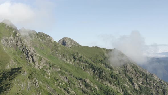 Aerial View Epic Natural Cliff Terrain Green Grass at Cloudy Smoke Organic Natural Environment