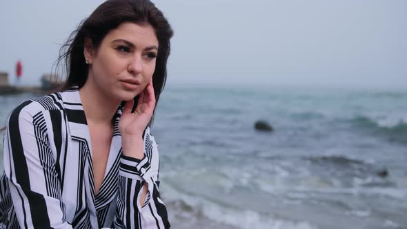 Beautiful Female Breathing on Beach Ocean in Background