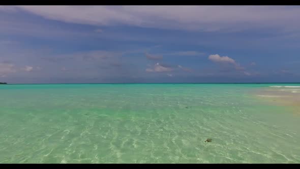 Aerial top down travel of exotic coastline beach holiday by clear water with bright sandy background