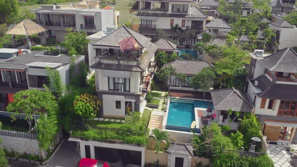 Flight Overlooking the Villa and Girls Near Uluwatu Town on Bali Island Indonesia