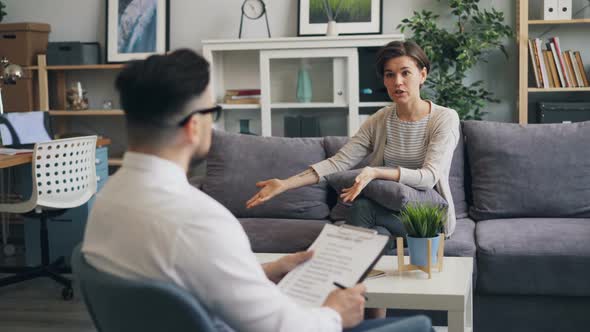 Angry Woman Expressing Emotions During Counselling Session with Psychologist