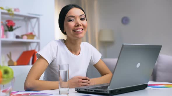 Happy Female Freelancer Smiling on Camera Sitting at Home Table, Modern Job