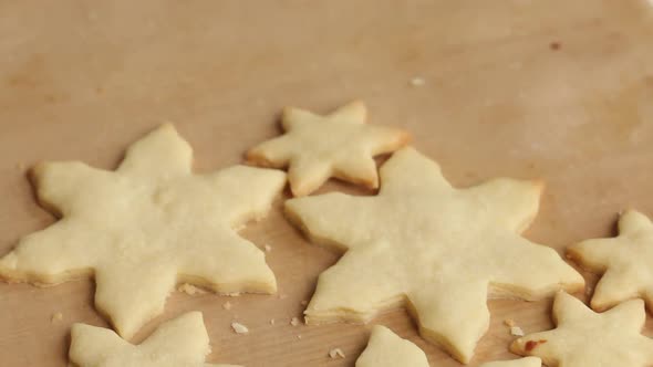 Rolled Out Dough. Cut Into Pieces In The Form Of A Heart And Snowflakes