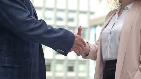 Handshake in the Courtyard of the Office Center