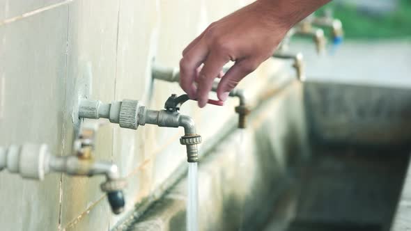 Water Dripping From Outside Taps