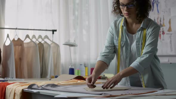 Concentrated on Her Work Designer Needling Templates to Fabric at Atelier