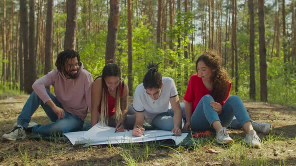 Eco Activists Drawing Ecological Poster Together