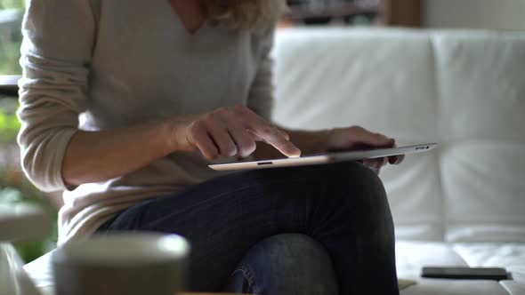 Mature woman doing online shopping at home