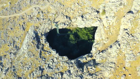 Top View on Sinkhole AkMechet Cave in Almaty Kazakhstan