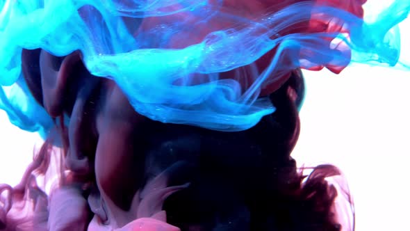 Color Ink Splash. Mysterious Illusion. Pink Smoke Cloud Puff on Blue Steam Abstract Background