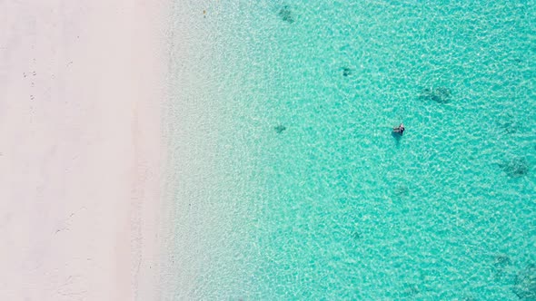 Aerial view of drone. Scene of top view beach and seawater on sandy beach in summer. Nature and trav