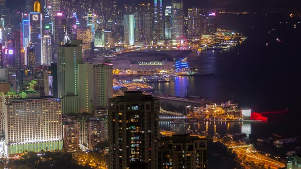 Hong Kong Urban Cityscape Aerial Skyline Panorama Timelapse at Night Pan Up