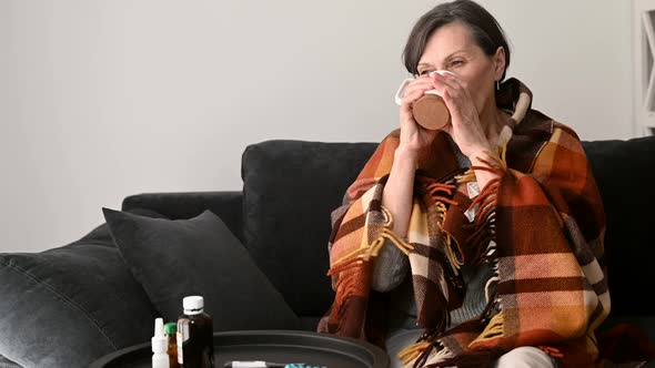 A Senior Woman Feels Sick at Home