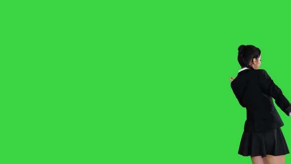 Active Attractive Girl Walking By and Dancing on a Green Screen, Chroma Key.