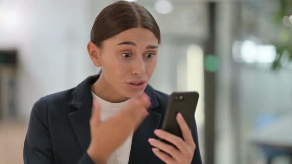 Portrait of Businesswoman Having Loss on Smartphone