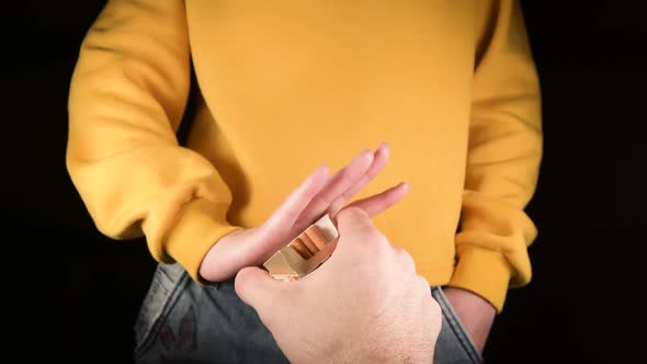 girl is offered cigarettes, but she refuses