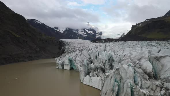 Iceland glacier with water close up with drone video moving forward.