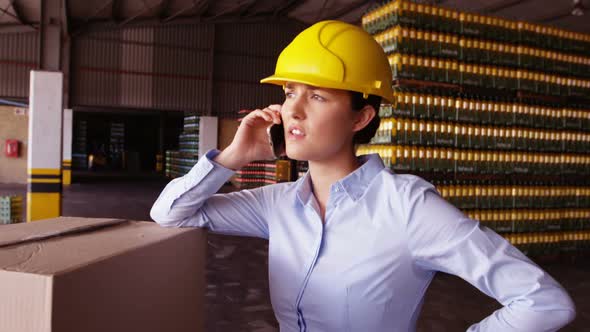 Female worker talking on mobile phone