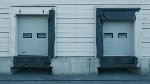 Clear Loading Bays Of A Warehouse In Dublin, Ireland - drone shot (backward)