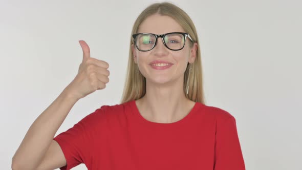 Thumbs Up by Young Woman on White Background