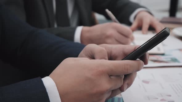 Hands of Businessman with Smartphone