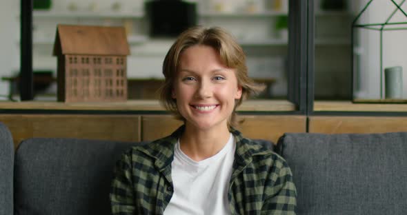 Portrait of Happy Open-minded Woman, Smiling at Camera