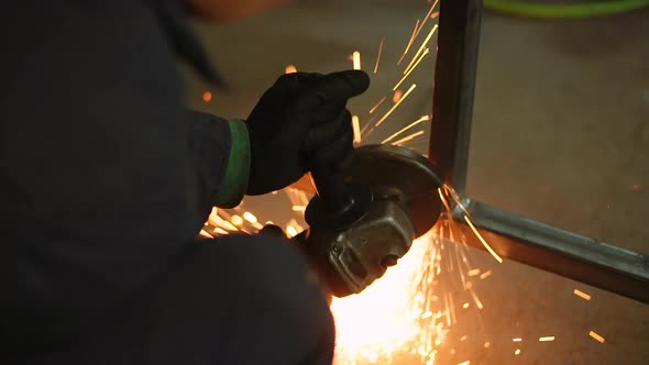 Angle Grinder Cutting Metal at Workshop