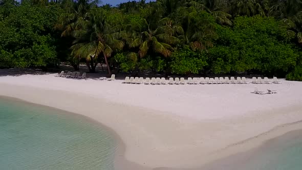 Aerial drone scenery of marine lagoon beach by blue lagoon with sand background