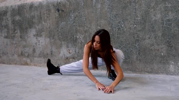 Young woman performing street dance