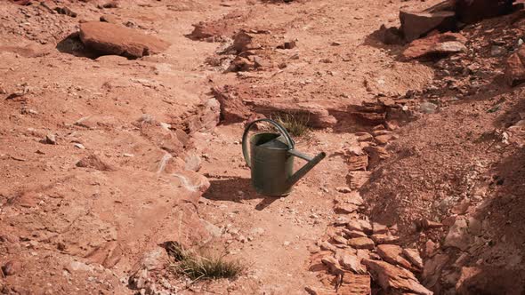 Beverage Can in Sand and Rocks Desert